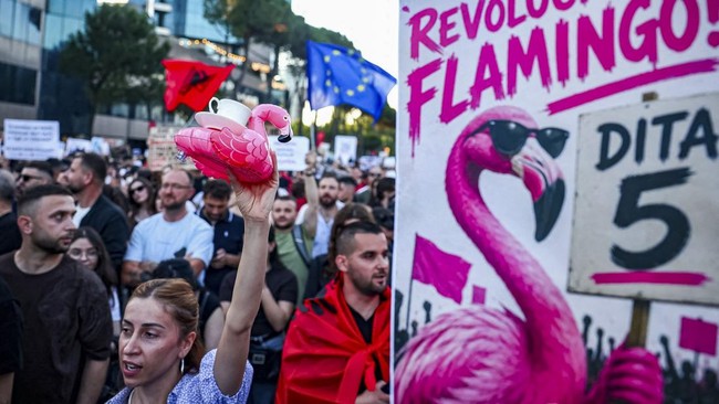 Protesters hold banners during a protest against a luxury resort development planned by a company linked with Donald Trump's son-in-law, Jared Kushner, on an environmentally sensitive part of the Adriatic coast, in Tirana, Albania, June 4, 2026. REUT