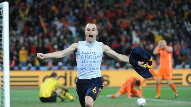 Spain's midfielder Andrs Iniesta celebrates after scoring in extra time of the 2010 FIFA football World Cup final between the Netherlands and Spain on July 11, 2010 at Soccer City stadium in Soweto, suburban Johannesburg. Spain won the match 1-0.  NO