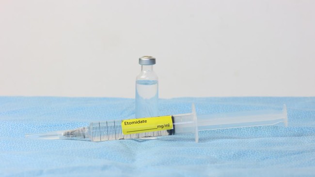 Etomidate drug. Glass bottle and syringe with Etomidate drug in a surface