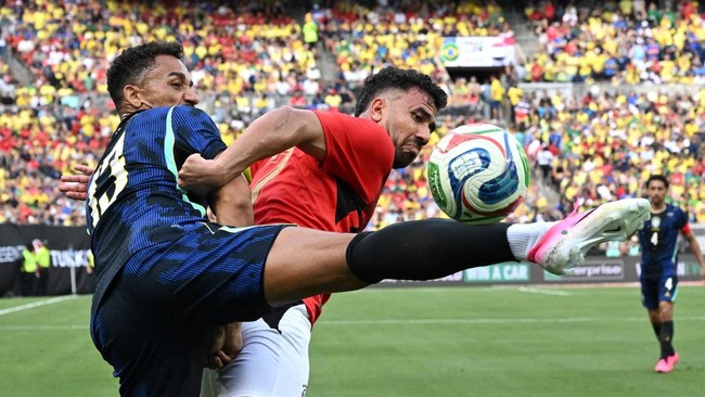 Soccer Football - International Friendly - Brazil v Egypt - Huntington Bank Field, Cleveland, Ohio, U.S. - June 6, 2026 Brazil's Danilo in action with Egypt's Mahmoud Trezeguet IMAGN IMAGES via Reuters/Ken Blaze     TPX IMAGES OF THE DAY