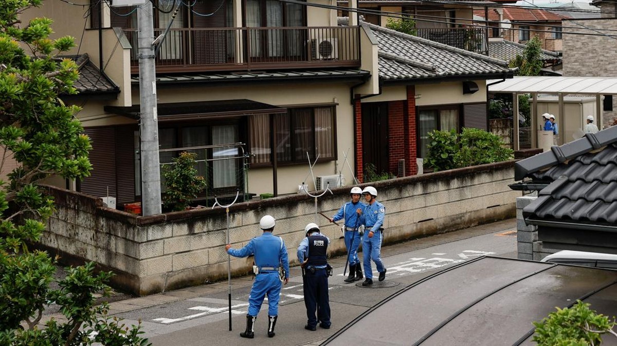 Police officers with sticks search for a black bear that was spotted at a residential area in Utsunomiya, Tochigi Prefecture, Japan, June 9, 2026. REUTERS/Kim Kyung-Hoon
