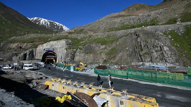 Mediapersons walk at the Zojila tunnel, India's longest road tunnel project connecting Jammu and Kashmir state with the Ladakh region on June 9, 2026. (Photo by TAUSEEF MUSTAFA / AFP)