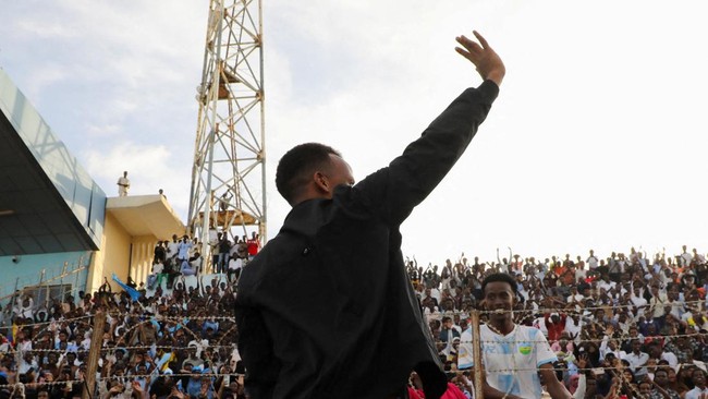 Somali referee Omar Abdulkadir Artan, who was expected to officiate at matches during the 2026. FIFA World Cup but was denied entry to U.S., waves towards fans at the Mogadishu stadium, in Mogadishu, Somalia, June 10, 2026. REUTERS/Feisal Omar     TP