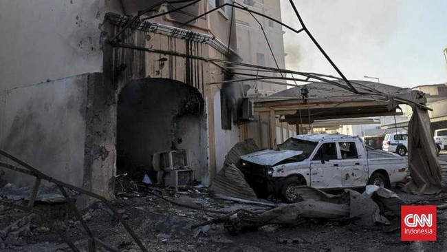 A damaged building and a vehicle in the aftermath of Iranian drone attacks, according to Bahrain's Interior Ministry, at a location given as Bahrain, in this handout image released on June 11, 2026. Ministry of Interior of the Kingdom of Bahrain/Hand