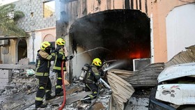 Firefighters work to extinguish fire in the aftermath of Iranian drone attacks, according to Bahrain's Interior Ministry, at a location given as Bahrain, in this handout image released on June 11, 2026. Ministry of Interior of the Kingdom of Bahrain/