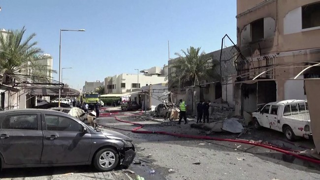 This screen grab taken from handout footage released by Bahrain TV on June 11, 2026, shows damage to buildings and vehicles in Bahrain reportedly caused by debris from intercepted drones. Iran warned on June 11 that the shaky ceasefire in the three-m
