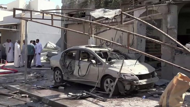 This screen grab taken from handout footage released by Bahrain TV on June 11, 2026, shows damage to buildings and vehicles in Bahrain reportedly caused by debris from intercepted drones. Iran warned on June 11 that the shaky ceasefire in the three-m