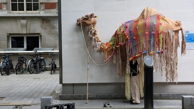 Members of the The Ishara Puppet Theatre Trust, with 12-foot-high handmade bamboo and cloth puppets, take part in a dress rehearsal for 'Giants on the move: A Puppet Street Parade', by Dadi Pudumjee, in South Kensington, central London on June 5, 202