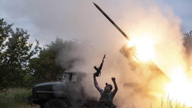 In this handout photograph taken on June 4, 2026 and released on June 5, 2026 by the press service of the 93rd Kholodnyi Yar Separate Mechanized Brigade of the Ukrainian Ground Forces, a Ukrainian soldier reacts as a MRLS BM-21 'Grad' fires towards R