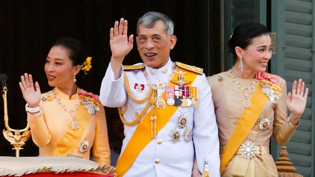 FILE PHOTO: Thailand's King Maha Vajiralongkorn, Queen Suthida and Princess Bajrakitiyabha wave from the balcony of Suddhaisavarya Prasad Hall at the Grand Palace where the king grants a public audience to receive the good wishes of the people in Ba