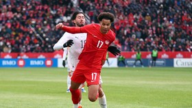 TORONTO, ON - MARCH 28: Tajon Buchanan #17 of Canada is fouled by Mikael Egill Ellertsson #19 of Iceland during an International Friendly at BMO Field on March 28, 2026 in Toronto, Ontario, Canada.   Vaughn Ridley/Getty Images/AFP (Photo by Vaughn Ri