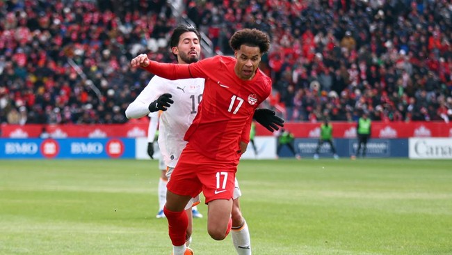 TORONTO, ON - MARCH 28: Tajon Buchanan #17 of Canada is fouled by Mikael Egill Ellertsson #19 of Iceland during an International Friendly at BMO Field on March 28, 2026 in Toronto, Ontario, Canada.   Vaughn Ridley/Getty Images/AFP (Photo by Vaughn Ri