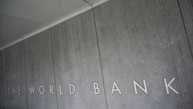 The World Bank Group logo is seen on the building of the Washington-based global development lender in Washington on January 17, 2019. World Bank current President Jim Yong Kim announced on January 7, 2019, that he would cut short his tenure as presi