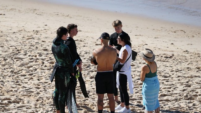 People react after reports of a shark attack at Coogee Beach in Sydney, Australia, June 13, 2026. REUTERS/Hollie Adams