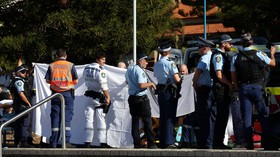 Police and emergency personnel at the scene after reports of a shark attack at Coogee Beach in Sydney, Australia, June 13, 2026. REUTERS/Hollie Adams