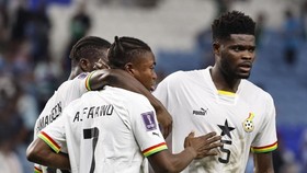 (FILES) Ghana's forward #07 Abdul Fatawu Issahaku and Ghana's midfielder #05 Thomas Partey react at the end of the Qatar 2022 World Cup Group H football match between Ghana and Uruguay at the Al-Janoub Stadium in Al-Wakrah, south of Doha on December