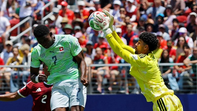 Soccer Football - FIFA World Cup 2026 - Group B - Qatar v Switzerland - San Francisco Bay Area Stadium, Santa Clara, California, U.S. - June 13, 2026 Qatar's Mahmoud Abunada makes a save from Switzerland's Breel Embolo REUTERS/Carlos Barria