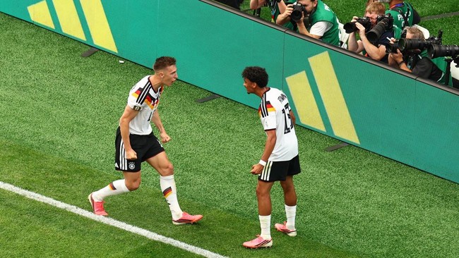 Soccer Football - FIFA World Cup 2026 - Group E - Germany v Curacao - Houston Stadium, Houston, Texas, U.S. - June 14, 2026 Germany's Nico Schlotterbeck celebrates scoring their second goal with Felix Nmecha REUTERS/Pedro Nunes