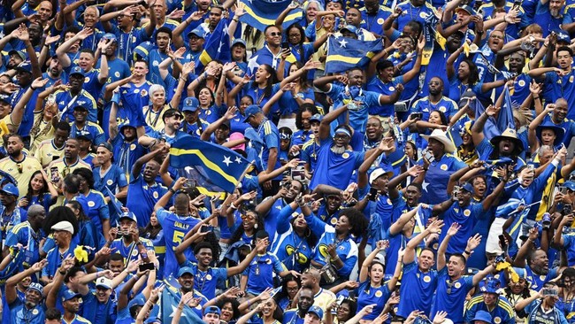 Soccer Football - FIFA World Cup 2026 - Group E - Germany v Curacao - Houston Stadium, Houston, Texas, U.S. - June 14, 2026 Curacao fans celebrate their first goal, scored by Livano Comenencia REUTERS/Annegret Hilse     TPX IMAGES OF THE DAY