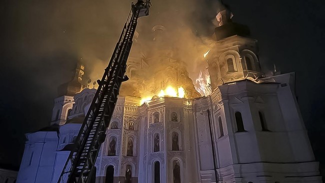Firefighters work at a site of the Dormition Cathedral of the Kyiv Pechersk Lavra monastery, which burns after it was hit during Russian missile and drone strikes, amid Russia's attack on Ukraine, in Kyiv, Ukraine June 15, 2026. Minister of Culture o