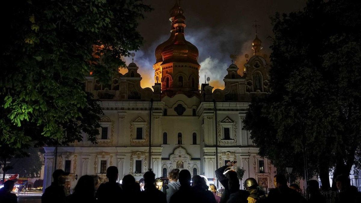 Journalists gather in front of the Dormition Cathedral of the Kyiv Pechersk Lavra, which was hit during Russian missile and drone strikes, amid Russia's attack on Ukraine, in Kyiv, Ukraine June 15, 2026. REUTERS/Valentyn Ogirenko