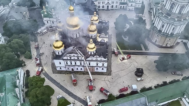 A drone view shows firefighters as they work to extinguish a fire at the Dormition Cathedral of the Kyiv Pechersk Lavra, which was hit during Russian missile and drone strikes, amid Russia's attack on Ukraine, in Kyiv, Ukraine June 15, 2026. Press se