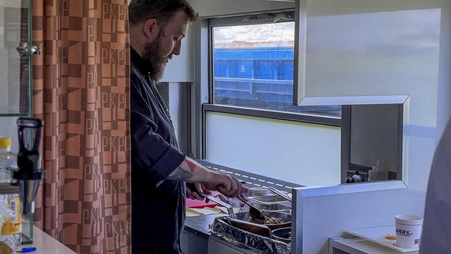 A cook prepares tradition Polish food in the dining car of the