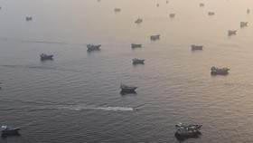 Vessels are anchored in the Strait of Hormuz, as seen from Musandam, Oman, June 11, 2026. REUTERS/Stringer