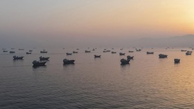 Vessels are anchored in the Strait of Hormuz, as seen from Musandam, Oman, June 11, 2026. REUTERS/Stringer