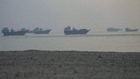 Vessels are anchored in the Strait of Hormuz, as seen from Musandam, Oman, June 11, 2026. REUTERS/Stringer