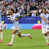 Soccer Football - FIFA World Cup 2026 - Group H - Saudi Arabia v Uruguay - Miami Stadium, Miami Gardens, Florida, U.S. - June 15, 2026 Uruguay's Maxi Araujo celebrates scoring their first goal with Federico Vinas and Agustin Canobbio REUTERS/Amanda P