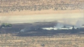 Smoke rises from a blackened part of Edwards Air Force Base after the crash of a U.S. Air Force B-52 bomber aircraft in Edwards, California, U.S., June 15, 2026, in a still image from news helicopter video. ABC Affiliate KABC via REUTERS     NO RESAL