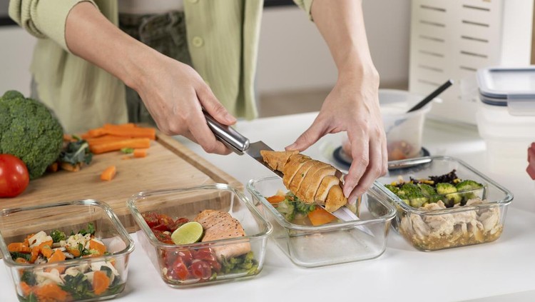 Woman preparing healthy homemade meal prep&comma; with fresh&comma; healthy food at home&period;