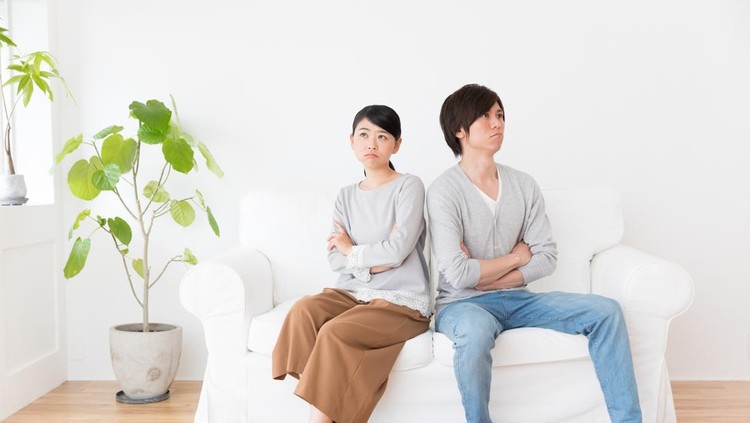 young asian couple in living room lifestyle image