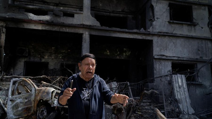 Youssef Fares, 90, shouts in frustration as he stands in front of his bombed home of more than 70 years, damaged in an Israeli airstrike, following a deal between the U.S. and Iran, in Tyre, southern Lebanon, June 16, 2026. REUTERS/Zohra Bensemra.