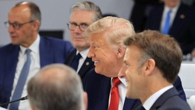 (From L) Germanys Chancellor Friedrich Merz, Britain's Prime Minister Keir Starmer, US President Donald Trump and France's President Emmanuel Macron attend a morning work meeting to revive balanced, inclusive, and sustainable economic growth for the