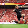 VANCOUVER, BRITISH COLUMBIA - JUNE 18: Jacob Shaffelburg #14 of Canada celebrates the team's fifth goal scored own goal by Mohamed Manai #26 of Qatar during the FIFA World Cup 2026 Group B match between Canada and Qatar at BC Place Vancouver on June