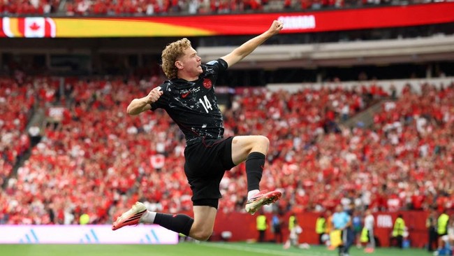 VANCOUVER, BRITISH COLUMBIA - JUNE 18: Jacob Shaffelburg #14 of Canada celebrates the team's fifth goal scored own goal by Mohamed Manai #26 of Qatar during the FIFA World Cup 2026 Group B match between Canada and Qatar at BC Place Vancouver on June 
