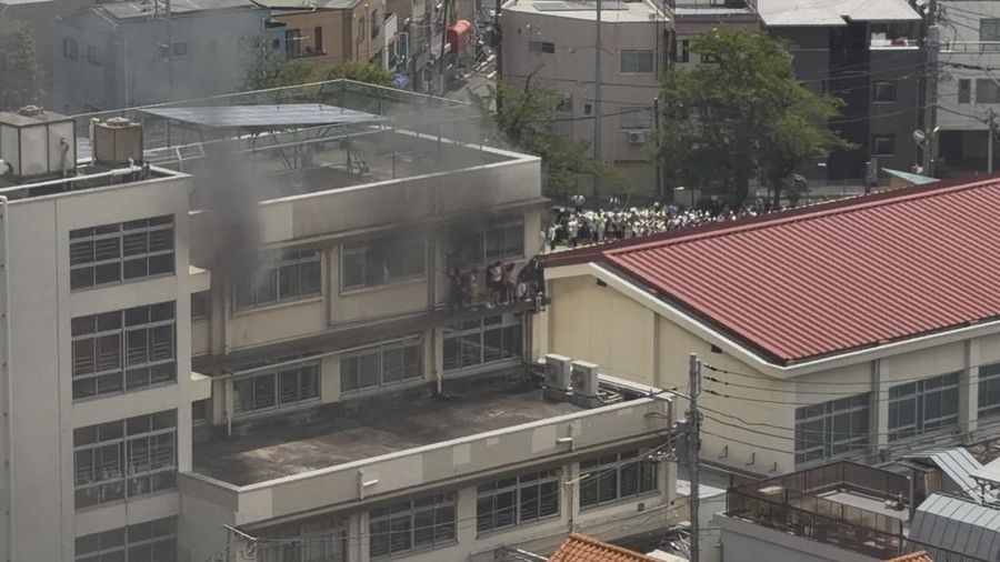 Smoke rises as students are evacuated from a primary school, after a fire broke out, in Kita city, Tokyo, Japan June 19, 2026, in this screengrab obtained from a social media video. @takanyo VIA X/via REUTERS  THIS IMAGE HAS BEEN SUPPLIED BY A THIRD