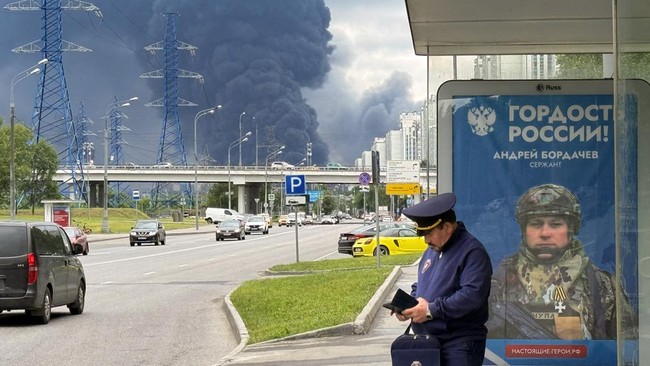 Black smoke rises from the area of the Russian oil producer Gazprom Neft's Moscow oil refinery on the south-eastern outskirts of Moscow on June 18, 2026. Moscow was fending off a