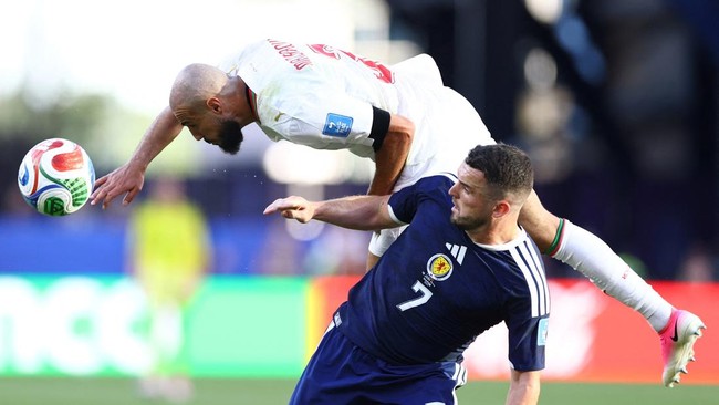 Soccer Football - FIFA World Cup 2026 - Group C - Scotland v Morocco - Boston Stadium, Foxborough, Massachusetts, U.S. - June 19, 2026 Scotland's John McGinn in action with Morocco's Noussair Mazraoui. REUTERS/Peter Cziborra