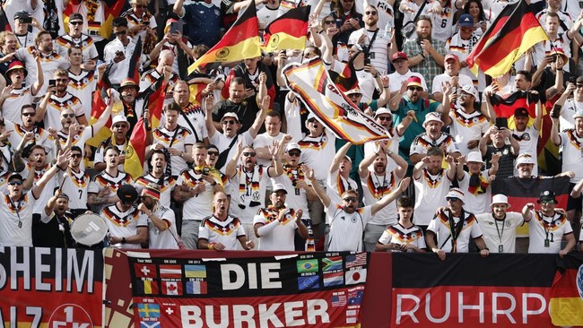 Soccer Football - FIFA World Cup 2026 - Group E - Germany v Ivory Coast - Toronto Stadium, Toronto, Canada - June 20, 2026 Germany fans celebrate with flags in the stands at the end of the match REUTERS/Benoit Tessier
