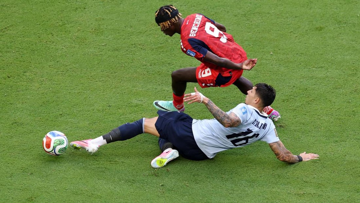 Soccer Football - FIFA World Cup 2026 - Group H -  Uruguay v Cape Verde - Miami Stadium, Miami Gardens, Florida, U.S. - June 21, 2026 Cape Verde's Gilson Benchimol in action with Uruguay's Mathias Olivera REUTERS/Paul Childs