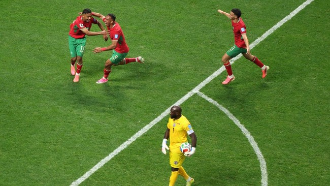 Soccer Football - FIFA World Cup 2026 - Group C - Morocco v Haiti - Atlanta Stadium, Atlanta, Georgia, U.S. - June 24, 2026 Morocco's Gessime Yassine celebrates scoring their fourth goal with Soufiane Rahimi as Haiti's Johny Placide looks dejected RE