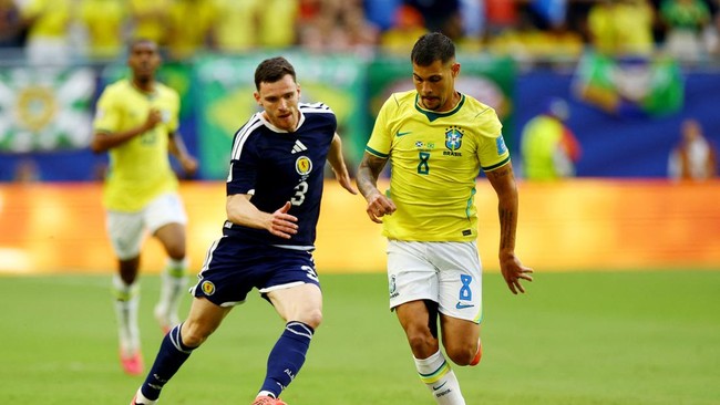 Soccer Football - FIFA World Cup 2026 - Group C - Scotland v Brazil - Miami Stadium, Miami Gardens, Florida, U.S. - June 24, 2026 Scotland's Andy Robertson in action with Brazil's Bruno Guimaraes IMAGN IMAGES via Reuters/Nathan Ray Seebeck