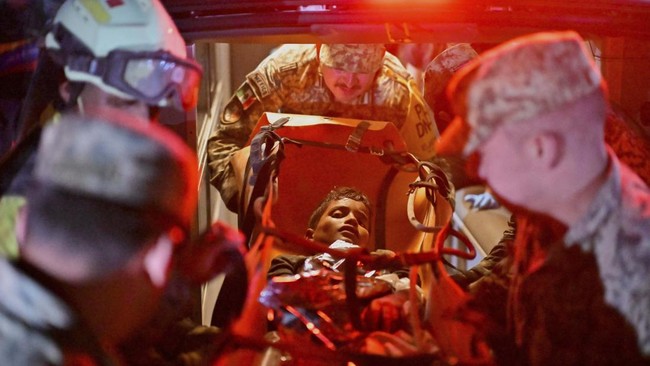 Jhonquer Cerpas, 13, is rescued by the Mexican brigade, in rescue efforts after earthquakes hit the country, in La Guaira, Venezuela, June 27, 2026. REUTERS/Maxwell Briceno