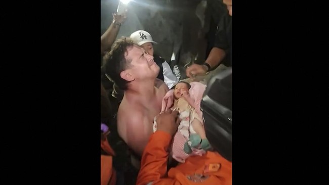 A screengrab taken from a video posted on Instagram on June 26, 2026 shows a newborn baby being pulled out alive from the rubble of the city of La Guaira, Venezuela, after twin earthquakes hit the country. The death toll from twin earthquakes in Vene