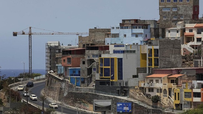 Cars descend from a hill near a residential area in Gamboa, in Praia, the southern end of Santiago island, Cape Verde, June 26, 2026. REUTERS/Sodiq Adelakun
