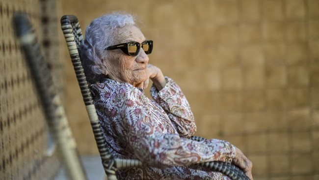 Zulina de Deus Nunes sits at the entrance of her home in Rio de Janeiro, Brazil, June 23, 2026. REUTERS/Tita Barros