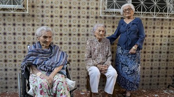 Zoraide de Deus Mota, 104, Zulina de Deus Nunes, 103, and Levita de Deus Nunes, 109, recognized as the world's oldest living trio of sisters, pose for a photo after samples were collected for longevity research in Rio de Janeiro, Brazil, June 23, 202